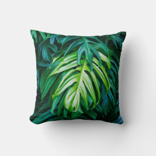 Tropical green leaves on dark background, nature s throw pillow