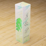 Tropical Green Leaves Watercolor Monogram Wine Box<br><div class="desc">Romantic splash of soft pink, green, yellow, blue tropical watercolor wash with green leaves on sides and back of Wedding Favour Wine Boxes. Lovely for your reception favour gifts for wine or champagne bottles tucked inside, or for anniversary or other special occasions. Personalize with the Bride and Grooms First Name...</div>