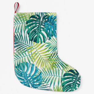 Tropical leaf design featuring green/blue palm and small christmas stocking