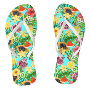 Tropical mix-fruit, flowers and leaves on blue flip flops