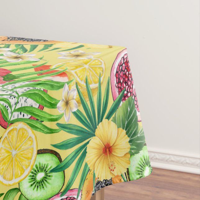 Tropical mix-fruit, flowers and leaves on yellow tablecloth (In Situ)