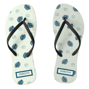 Tropical monstera leaves monogram on blue flip flops