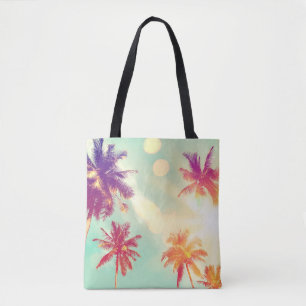 Tropical palm tree with colorful bokeh sun light o tote bag