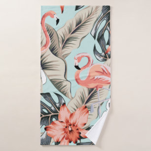 Tropical pink flamingo with orchid flowers and lea bath towel