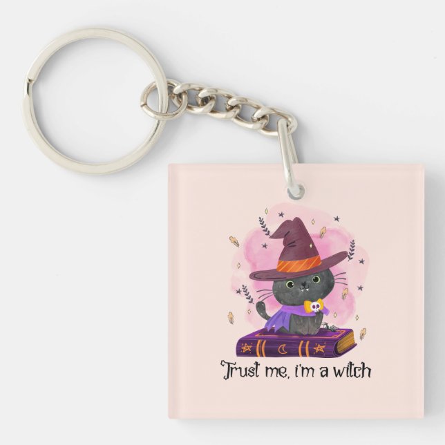 Trust Me I'm A Witch – Witch Cat on Magic Book Keychain (Front)