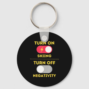 Turn on skiing turn off negativity snow slopes keychain