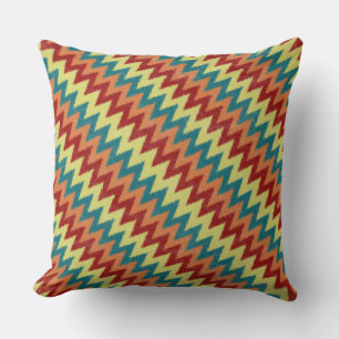 Turquoise, red, orange and yellow zigzag throw pillow