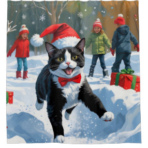 Tuxedo Cat Running in Snow with Christmas Hat