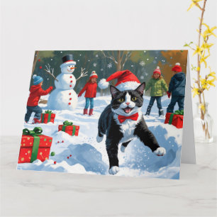 Tuxedo Cat Running in Snow with Christmas Hat Card