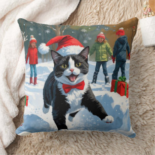 Tuxedo Cat Running in Snow with Christmas Hat Throw Pillow