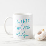 TWENTY & THRIVING 20th Birthday Funny Personalized Coffee Mug<br><div class="desc">Celebrate turning twenty in style with this vibrant TWENTY & THRIVING birthday mug featuring bold turquoise lettering. This custom name coffee mug makes a fun and thoughtful gift for anyone embracing their twenties with confidence and energy. A perfect keepsake for morning coffee, dorm life, or birthday brunch. Also available in...</div>