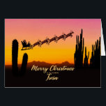 Twin Christmas Santa Over Desert<br><div class="desc">A Christmas card for your twin showing Santa flying over the desert. Lots of tall cactus are seen in silhouette. Wish a merry Christmas from the desert with a lovely sunset coloured card.</div>
