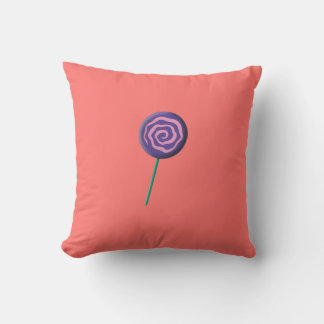 Twirled purple lollipop with pink throw pillow