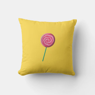 Twirled red lollipop with pink throw pillow