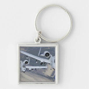 Two A-10C Thunderbolt II aircraft fly in format Keychain