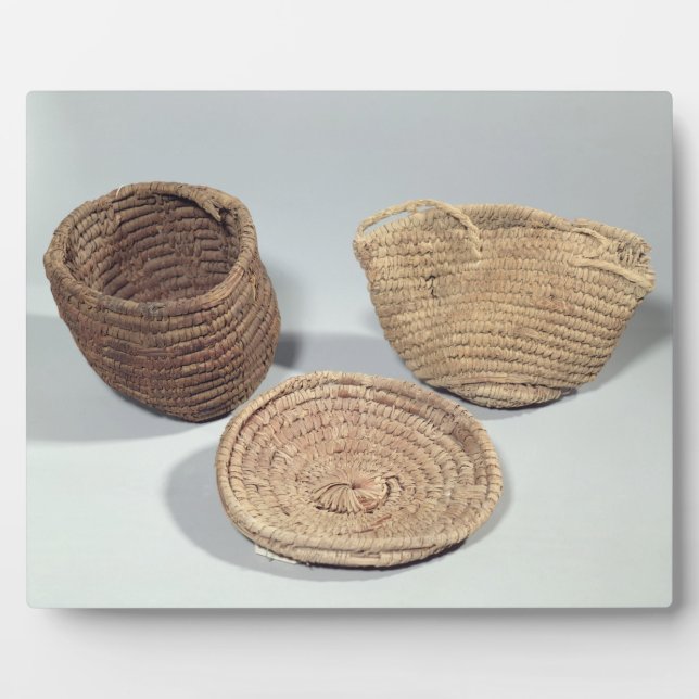 Two baskets and a cover (woven palm fronds) plaque (Front)