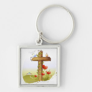 Two birds perching on a cross keychain