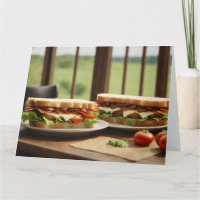 Two BLT sandwiches by window