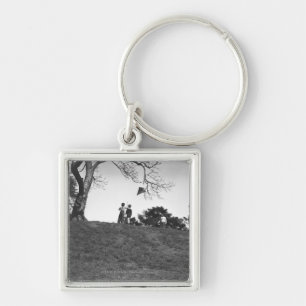 Two boys flying kite on hill B&W Keychain