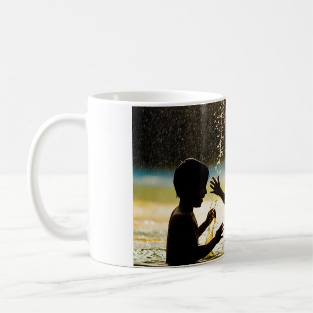 Two boys playing in a waterfront coffee mug (Left)
