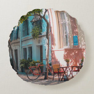 Two brown table outside round pillow