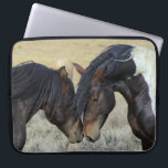 Two Brown Wild Horses Nuzzling Laptop Sleeve<br><div class="desc">A pair of brown wild horses sharing a tender moment in a grassy field. These two brown paint horses can be seen gently nuzzling each other,  enjoying each others company. Their tousled manes blowing in the breeze. Displaying power,  kindness and freedom. Great for horse lovers.</div>