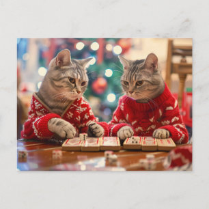 Two cats in red sweaters with festive background holiday postcard