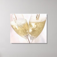 Two champagne flutes being filled with sparkling