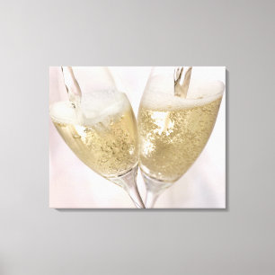 Two champagne flutes being filled with sparkling canvas print
