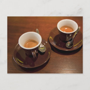 two cups of freshly brewed espresso coffee on a postcard
