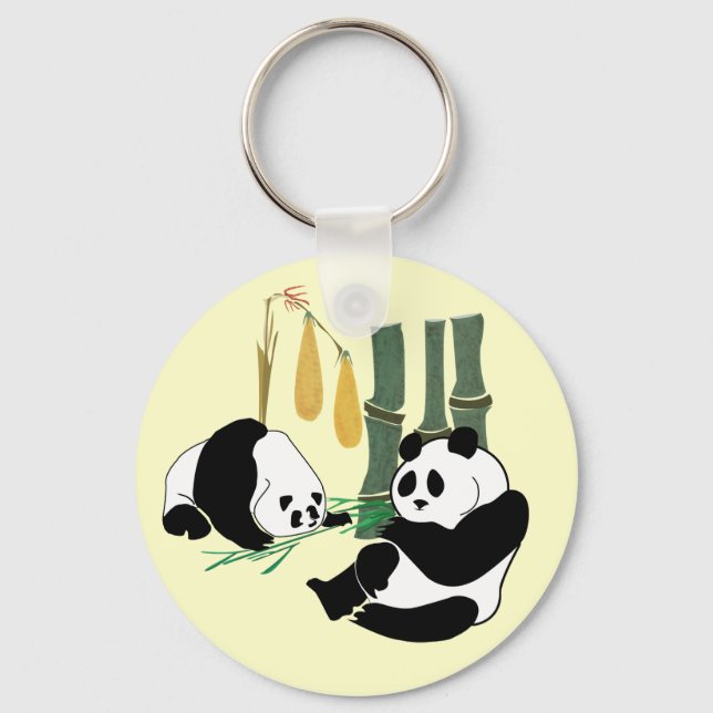 Two Cute Pandas eat bamboo in tropical forest Keychain (Front)