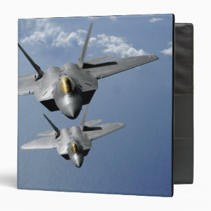 Two F-22 Raptors fly over the Pacific Ocean Binder