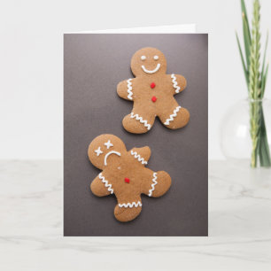 Two gingerbread men on grey holiday card