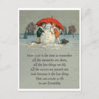 Two girls together with snowman under red umbrella postcard