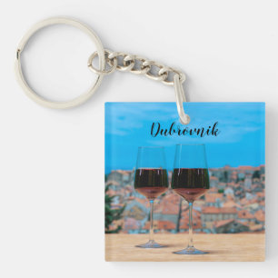 Two glasses of red wine with view of Dubrovnik Keychain