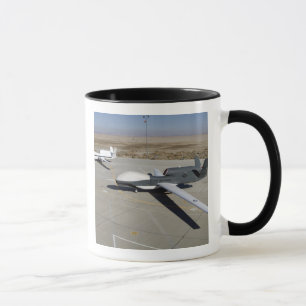 Two Global Hawks parked on a ramp Mug