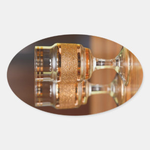 Two Golden Glasses Oval Sticker