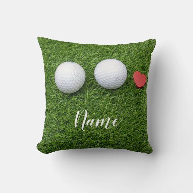 Two Golf balls and  love heart are on green grass Throw Pillow (Front)