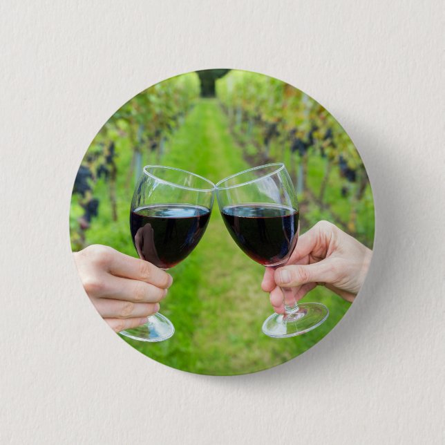 Two hands toasting with wine glasses in vineyard 2 inch round button (Front)