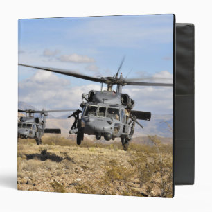 Two HH-60 Pavehawk helicopters preparing to lan Binder