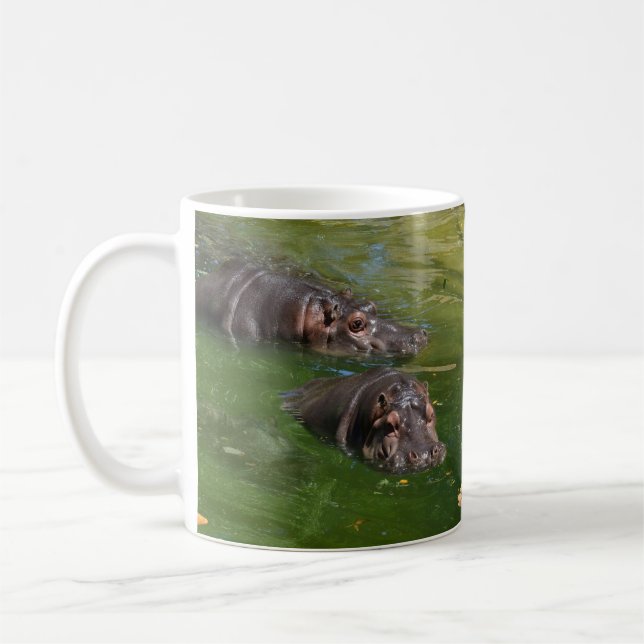 Two Hippos Swimming In Pond,   Coffee Mug (Left)