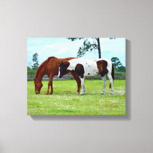 Two horses grazing canvas print