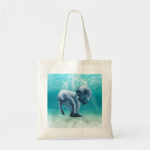 Two Manatees Swimming Tote Bag