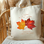 Two Maple Leaves Fall Wedding Welcome Bag<br><div class="desc">Two autumn leaves, wedding welcome bag with custom text. Affordable little cloth tote bag makes a special gift for guests travelling to a fall wedding. Golden orange and red maple leaves in the centre hold the date of the event. Welcome to location at the top in dark green, modern script,...</div>