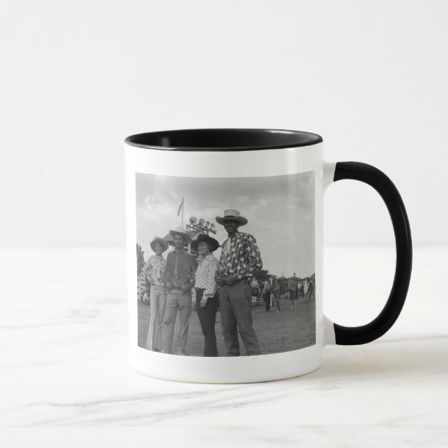 Two men and two women at a rodeo mug (Right)