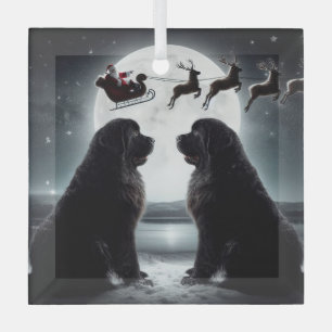Two Newfs and Santa on His Way  Glass Ornament