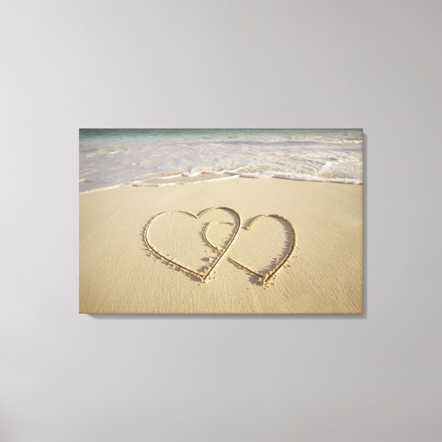 Two overlying hearts drawn on the beach canvas print (Front)