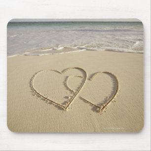Two overlying hearts drawn on the beach mouse pad