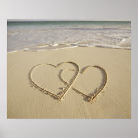Two overlying hearts drawn on the beach