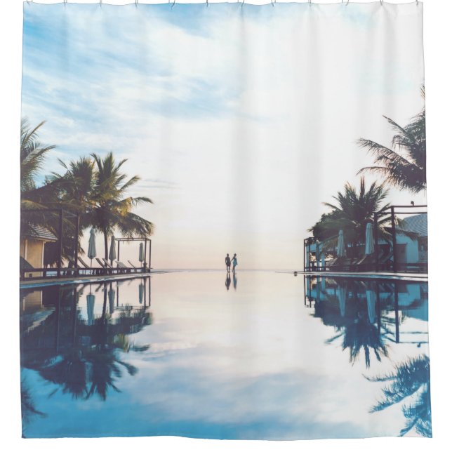 Two person standing beside swimming pool (Front)